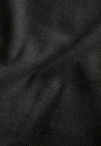 Black ribbed fabric with a smooth texture, featuring prominent vertical lines and subtle variations in shading.