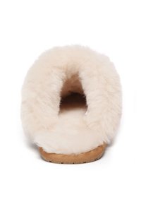 Fluffy cream-colored slipper featuring a soft fur upper and a natural wood sole, open back design, and textured surface for grip.