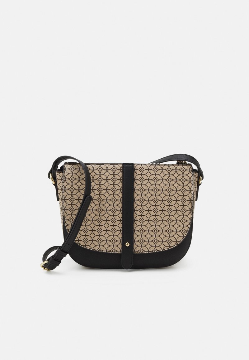 Beige crossbody bag with black accents; features a geometric pattern, a flap closure, and an adjustable strap. Smooth texture.