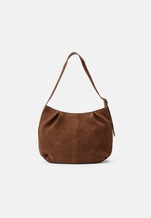 Brown suede shoulder bag with a curved shape, single strap, and stitched detail on the front. Soft texture and no visible hardware.