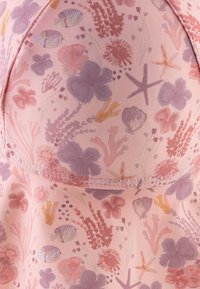 Floral swimwear fabric featuring a pink background with purple and red coral, seashells, starfish, and fish in a soft, textured design.