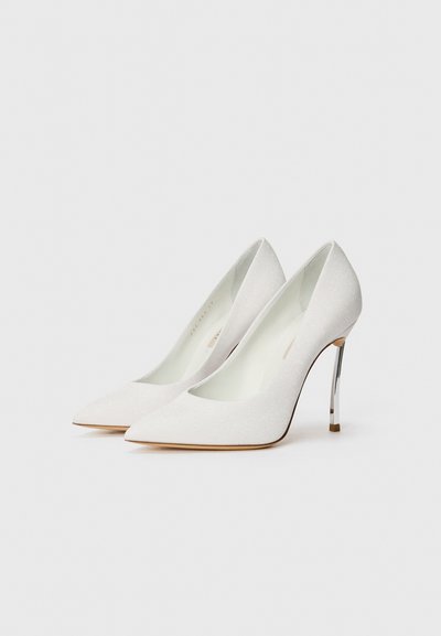 White glittery high heels with pointed toes, a sleek design, and a metallic stiletto heel. Smooth interior lining.