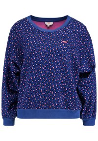 Sweat-shirt violet avec imprimé léopard noir et rose, col et poignets côtelés, coupe ample, et petite étiquette de marque sur le devant.