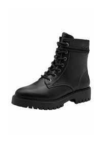 Bottines en cuir noir avec un laçage à l'avant, bout rond et semelle épaisse et robuste. Caractérisées par des œillets en métal et des détails de couture contrastants.