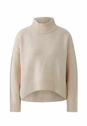Hellbeige Rollkragenpullover mit cropped Design, geripptem Kragen und Saum sowie locker sitzenden Ärmeln. Hergestellt aus einem strukturierten Strickmaterial.