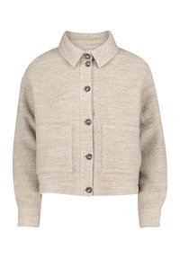 Veste beige courte en tissu texturé, avec un col, six boutons foncés et deux poches avant.