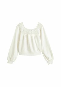 Bílé zkrácené sweatshirt má dlouhé nafouklé rukávy, čtvercový výstřih a vyšívané detaily na horní části přední strany. Měkká textilie.