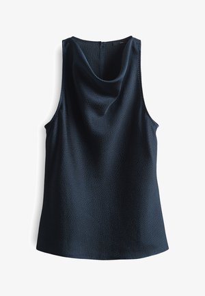 Débardeur sans manches en marine avec un tissu texturé, un col rond et une fermeture éclair au dos. Sa coupe fluide et sa coupe ample augmentent le confort.