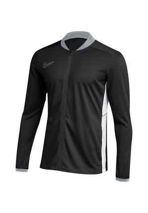 Schwarze Sportjacke mit Reißverschluss und langen Ärmeln, grauem Kragen und Bündchen, weißen Seitenteilen und kleinem Logo auf der Brust.