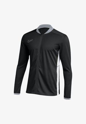 Schwarze Sportjacke mit Reißverschluss und langen Ärmeln, grauem Kragen und Bündchen, weißen Seitenteilen und kleinem Logo auf der Brust.