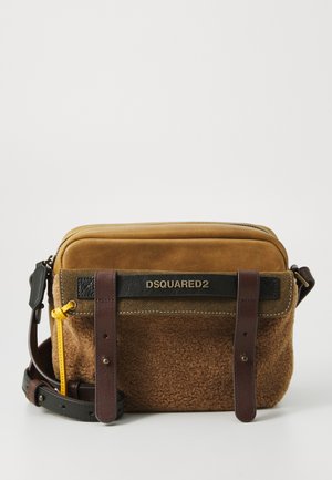 Brown crossbody bag featuring a mix of suede and textured fabric, black hardware, brown leather straps, and a yellow zipper pull.