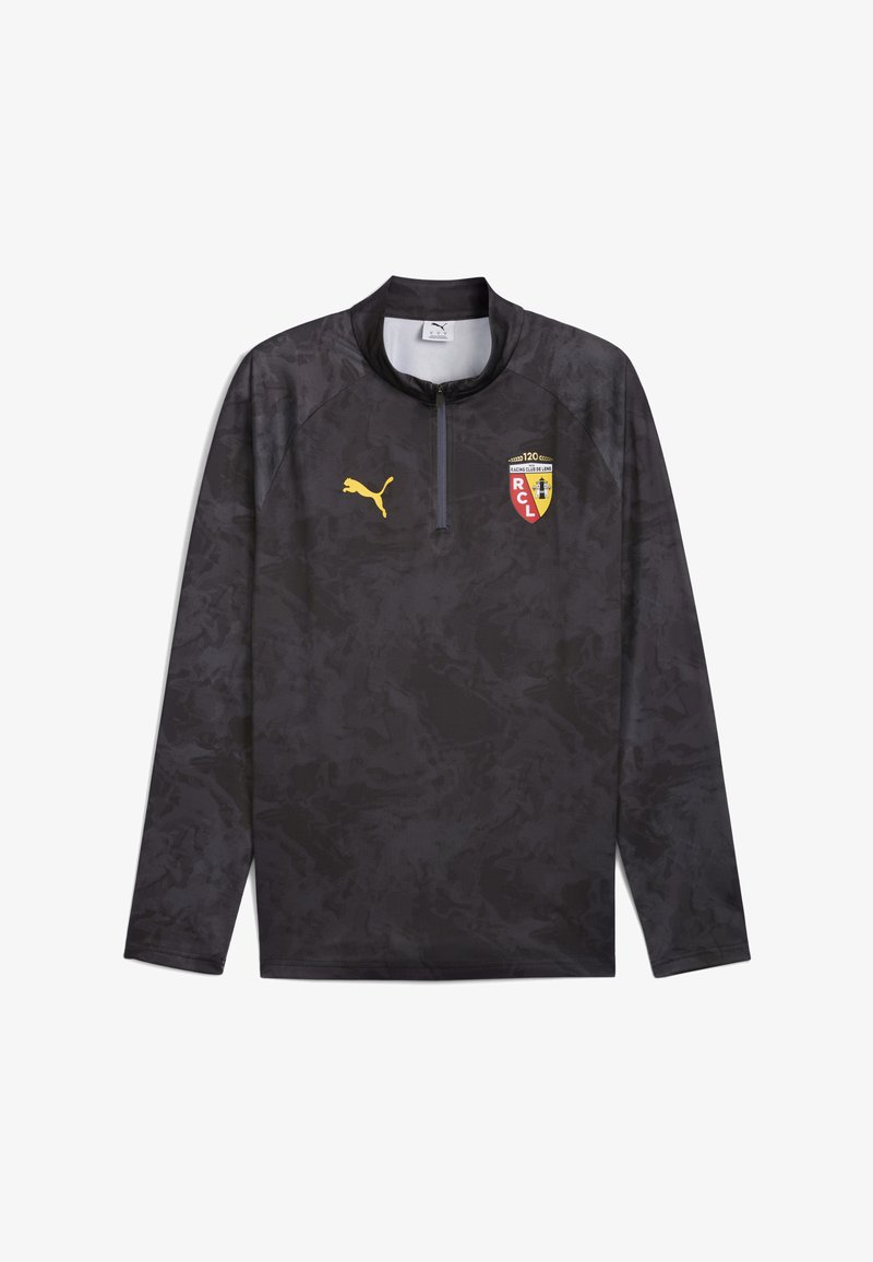Top deportivo negro de manga larga con un sutil patrón abstracto, cuello con media cremallera y logo de Puma; presenta un escudo de equipo con acentos en rojo y amarillo.