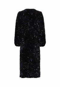 Juoda blizgučiais dekoruota suknelė, laisvo kirpimo, ilgos rankovės ir iki kelių ilgio. Pasižymi tekstūruota, blizgančia paviršiumi ir apvaliu iškirpimu.