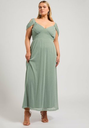 Maxi dress in light green fabric with shimmer, off-the-shoulder straps, fitted bodice, and flowing skirt, ideal for formal occasions.