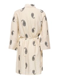 Krém színű, hosszú ujjú ruha fekete paisley mintákkal, gallérral és elasztikus derékpánttal, hátulról látható.