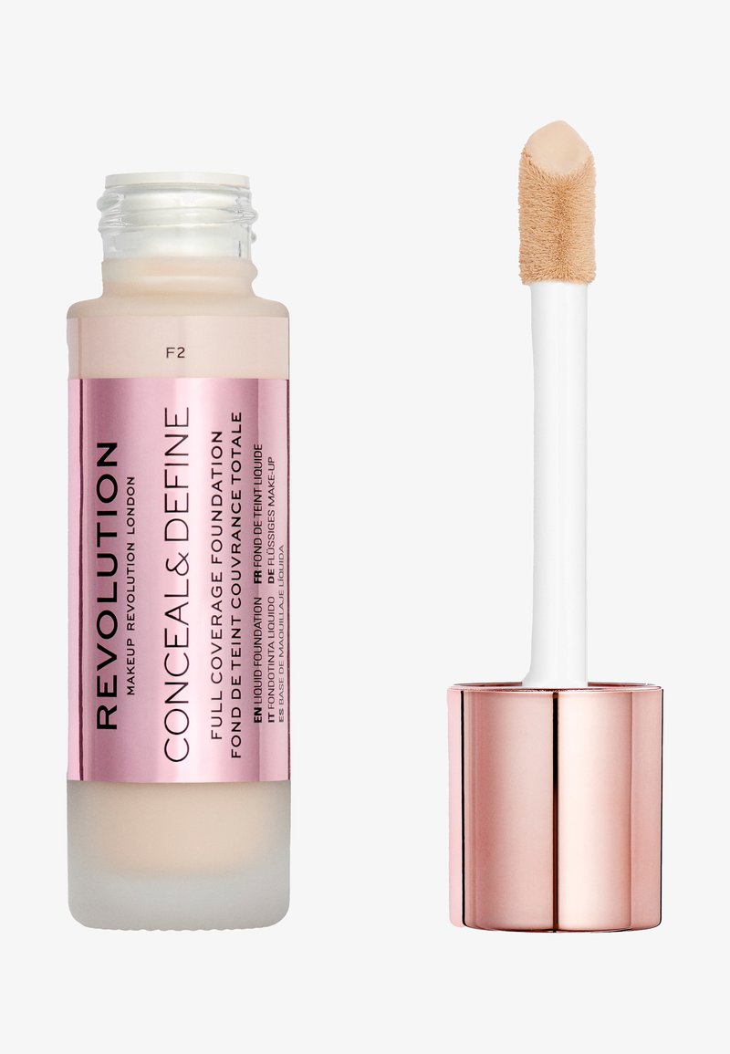 Revolution Conceal & Define foundation in a clear glass bottle with pink accents. Features a tapered applicator for easy use. Shade F2.