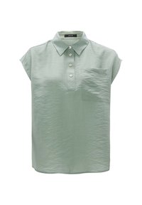 Lys grøn, kortærmet bluse med krave, fem knaplukninger og en brystlomme. Fremstillet af et krøllet tekstil.