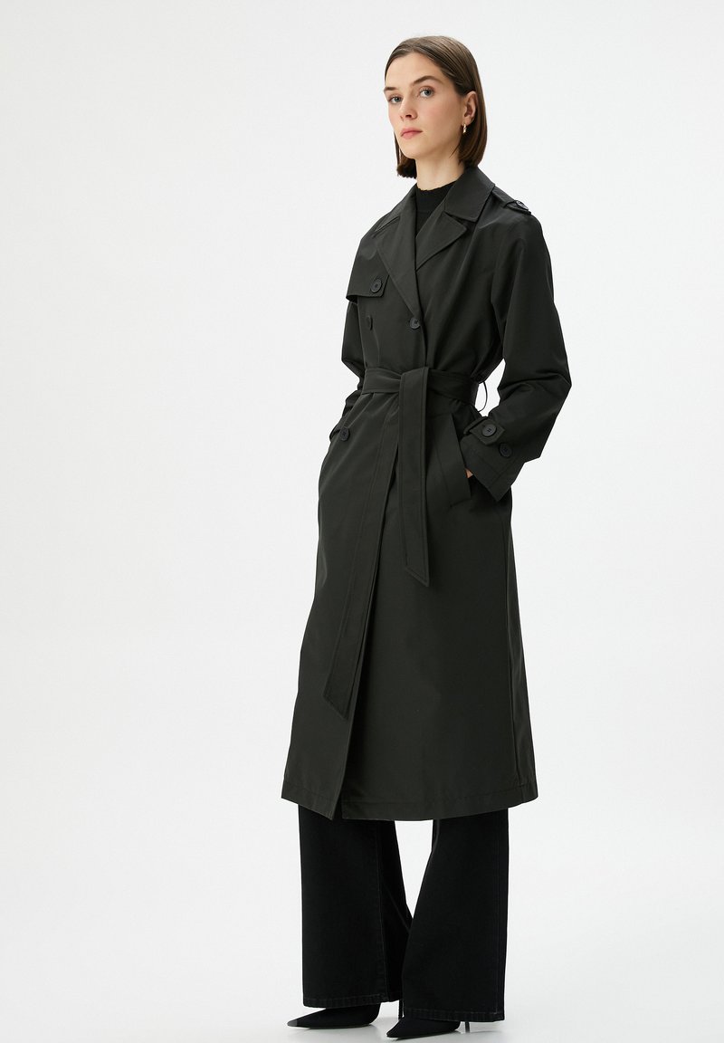 Damesmantel, lang model, met riem, met zakken, winddicht, elegant, knielang, trenchcoat, winterjas, overgangsjas, modieuze windjas