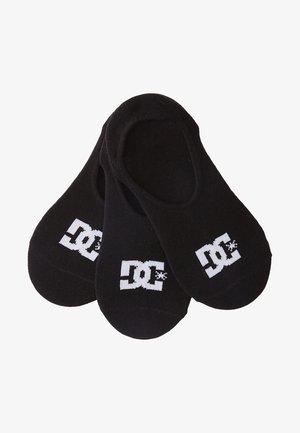 Schwarze Sneaker-Socken aus einem Mischgewebe mit Baumwolle, die an den Seiten das weiße DC-Logo tragen. Einfaches Design mit glatter Textur.