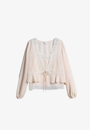 Hellrosa langärmlige Bluse mit Spitzenbesatz am Ausschnitt, an der Brust und am Saum, mit einer vorderen Schleife und leichtem Rüschensaum unten.