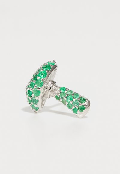 Emerald green gemstone ring with a textured silver band, featuring a domed top and scattered accent stones for contrast.