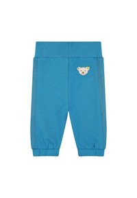 Pantalones azules para niños hechos de material suave, con un aplique de oso en la parte frontal y acentos de malla a lo largo de los lados. Cintura y puños elásticos.