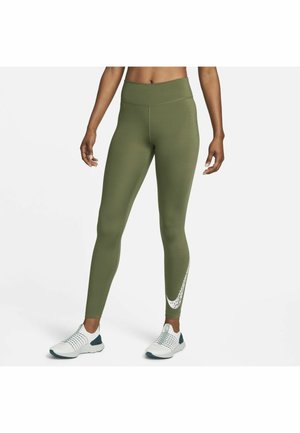 Leggings verde oliva a vita alta realizzati in tessuto elasticizzato, con un motivo astratto bianco sulla parte inferiore della gamba.