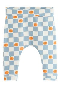 Blue and white checkered baby pants with small orange pumpkin illustrations scattered across the fabric.