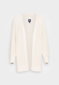 Vaaleancremeäinen neulotun takin, jossa on avoin etuosa, ribbaa hihansuissa ja teksturoitu kuosi. Kangas on pehmeä ja kevyt, suunniteltu kerroksittain käytettäväksi.