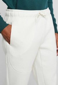Urban Classics CUT AND SEW PANTS - Tréningruha alsók - sand