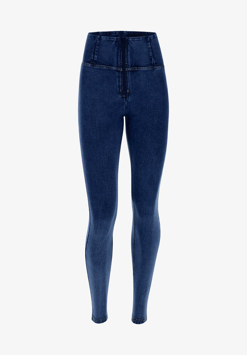 Jean skinny bleu foncé taille haute avec fermeture éclair devant et coutures visibles le long des jambes et de la ceinture.