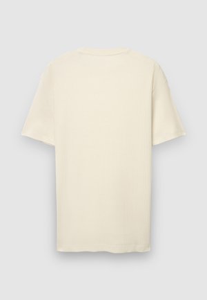 T-shirt à manches courtes de couleur crème en tissu côtelé. Dispose d'un col rond et d'une coupe droite avec un ourlet net.