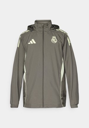 Hallide hall jacket, millel on kapuuts, heledad rohelised aktsendid, lukuga sulgemine ja tikandiga logo. Omab küljetaskuid ja elastseid mansette.