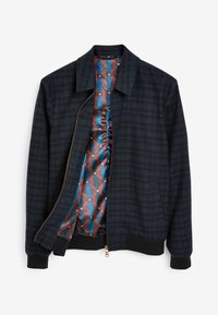 Navy jacket with checked pattern, front zipper, and ribbed cuffs. Interior features a geometric patterned lining in blue, red, and brown.