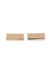 Gold-toned metal rectangular clips with polished finish. Features engraved brand name on one side; smooth surface with sharp edges.