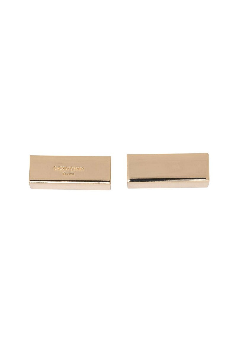 Gold-toned metal rectangular clips with polished finish. Features engraved brand name on one side; smooth surface with sharp edges.