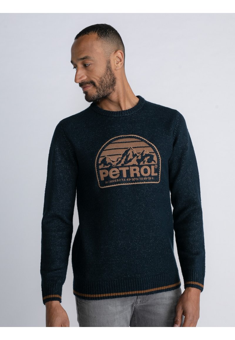 Marineblauer Strickpullover mit Rundhalsausschnitt und einer Berggrafik in Hellbraun. Verfügt über gerippte Bündchen und Saum mit Akzentstreifen.