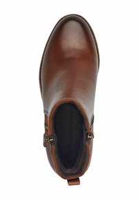 Braune Lederstiefelette mit seitlichem Reißverschluss und weichem schwarzem Fellfutter, von oben betrachtet.