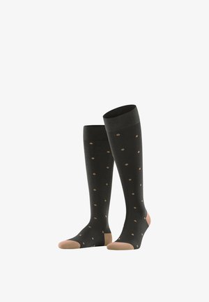 Kousen tot aan de knie in donkergrijs met beige stippen; verstevigde tenen en hielen; gladde textuur; geribbelde boorden voor een stevige pasvorm.