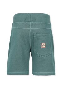 Gröna bomullsshorts med ribbad midja, bakficka och kontrasterande sömmar. Har en liten logotyp på fickan.