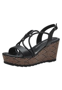 Black wedge sandals with three straps, a closed heel, and a patterned cork wedge featuring wave designs in a light brown tone.