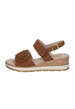 Sandale en cuir marron avec accents floraux, design à bout ouvert, bride de cheville ajustable et talon compensé en liège avec semelle blanche.