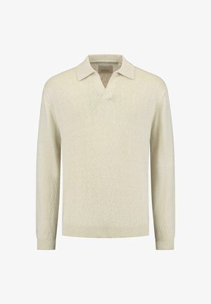 Heledbeez pikkade varrukatega polo-sviiter v-kaelusega, ribased mansetid ja serv, millel on tekstuuriga kudumine.