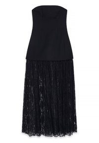 Juoda be petnešų suknelė su prigludusia liemene ir plazdančiu nėrinių sijonu. Liemenė yra lygi, puikiai deranti prie tekstūrinio nėrinių audinio.