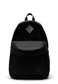 Black backpack made of durable fabric, featuring a textured flap with subtle stripes, a front zip pocket, and a top carry handle.