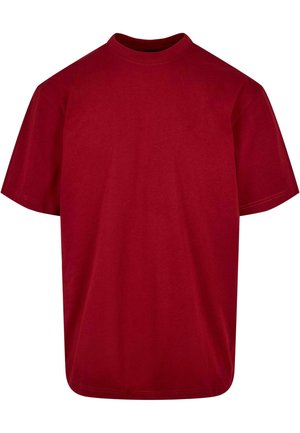 Red cotton t-shirt with short sleeves, round neckline, and a relaxed fit. Plain design, no patterns or graphics. Smooth texture.