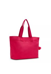 Borsa a tracolla rosa con due manici robusti, realizzata in tessuto testurizzato, con un dettaglio pom-pom attaccato al lato. Design rettangolare spazioso.