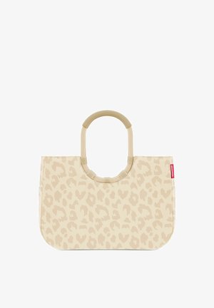 Beige tote bag with light leopard spots pattern, round padded handles, and a small red brand tag on the side.