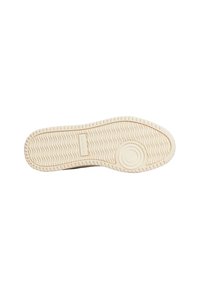 Suola della scarpa in gomma beige caratterizzata da un motivo a onde, superficie testurizzata e dettaglio circolare vicino al tallone. Design piatto con bordi rialzati.