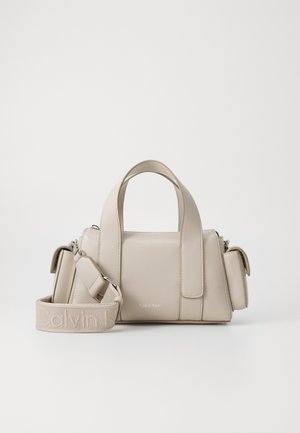 Beige bag with structured design, made of synthetic material. Features two top handles, a detachable shoulder strap, and a zip pocket.